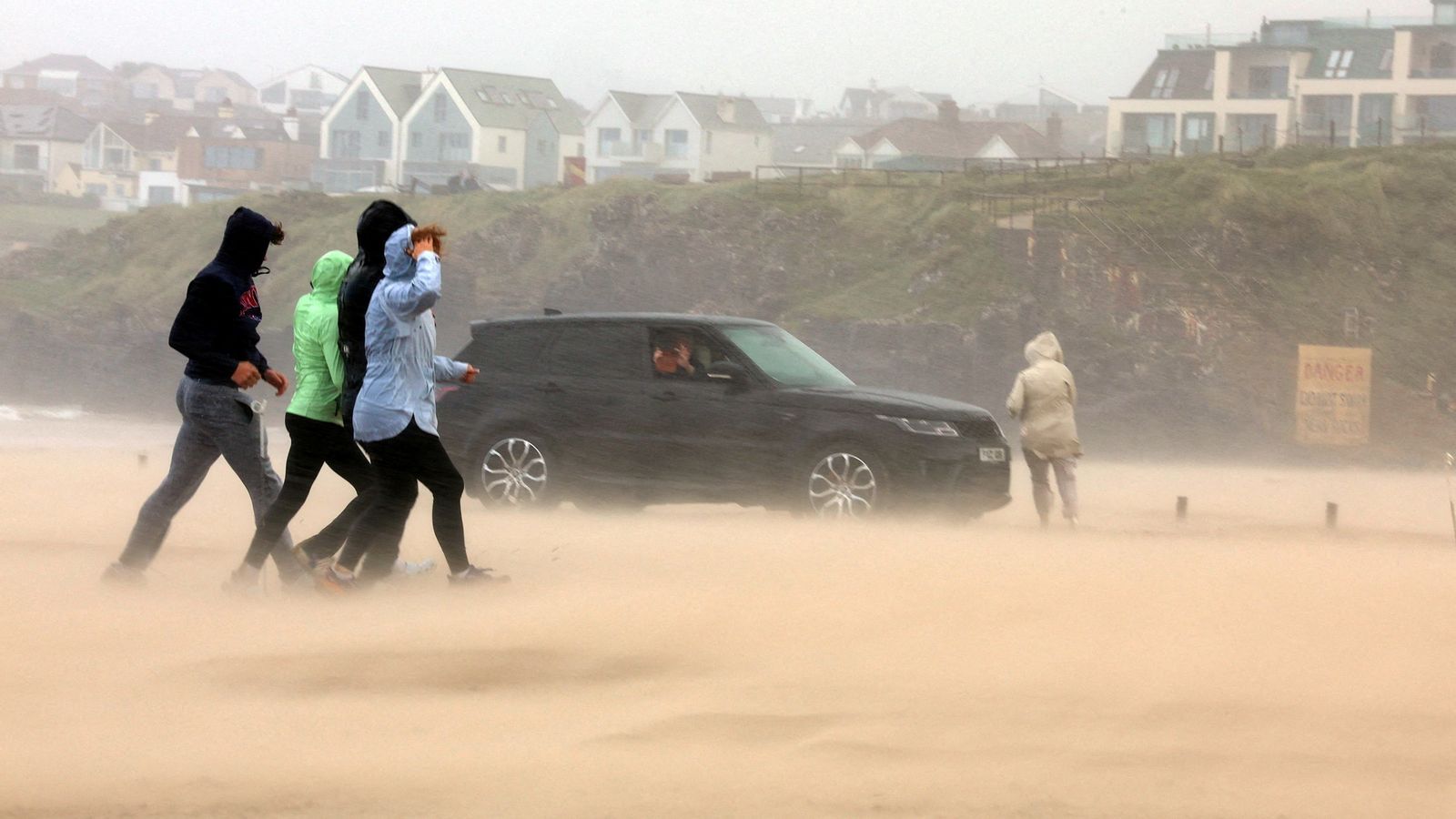 You are currently viewing Storm Floris latest: Winds up to 124mph hit UK – as 32,000 homes without power and plane filmed struggling to land – Sky News